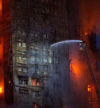 13 people killed in fire engulfing Hong Kong high-rise residential buildings, fire services say : NPR