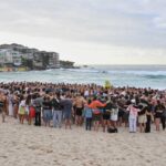 Suspected gunman in Bondi Beach shooting charged with 15 counts of murder : NPR